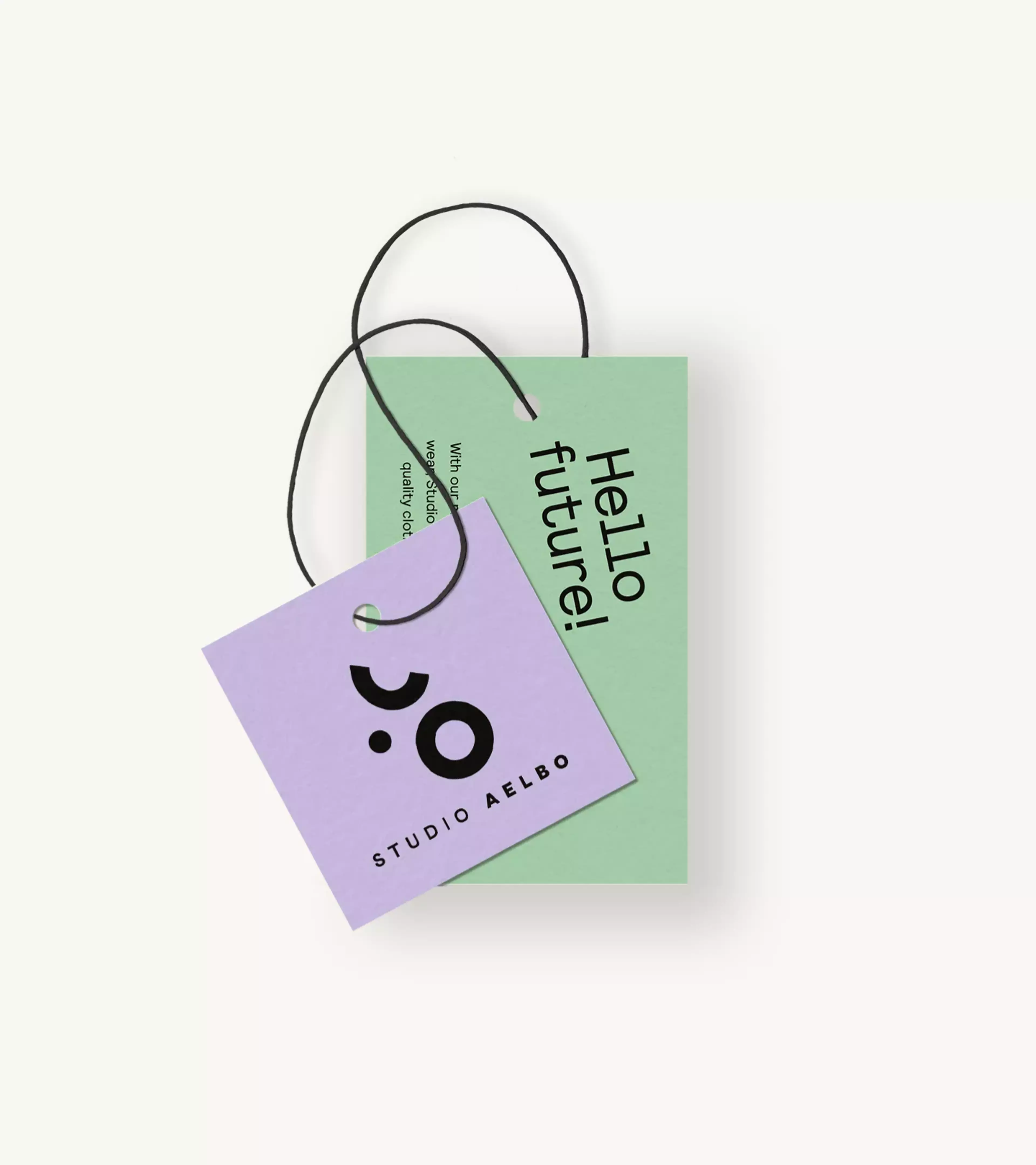 Two hangtags in the colors light green and purple on a beige background