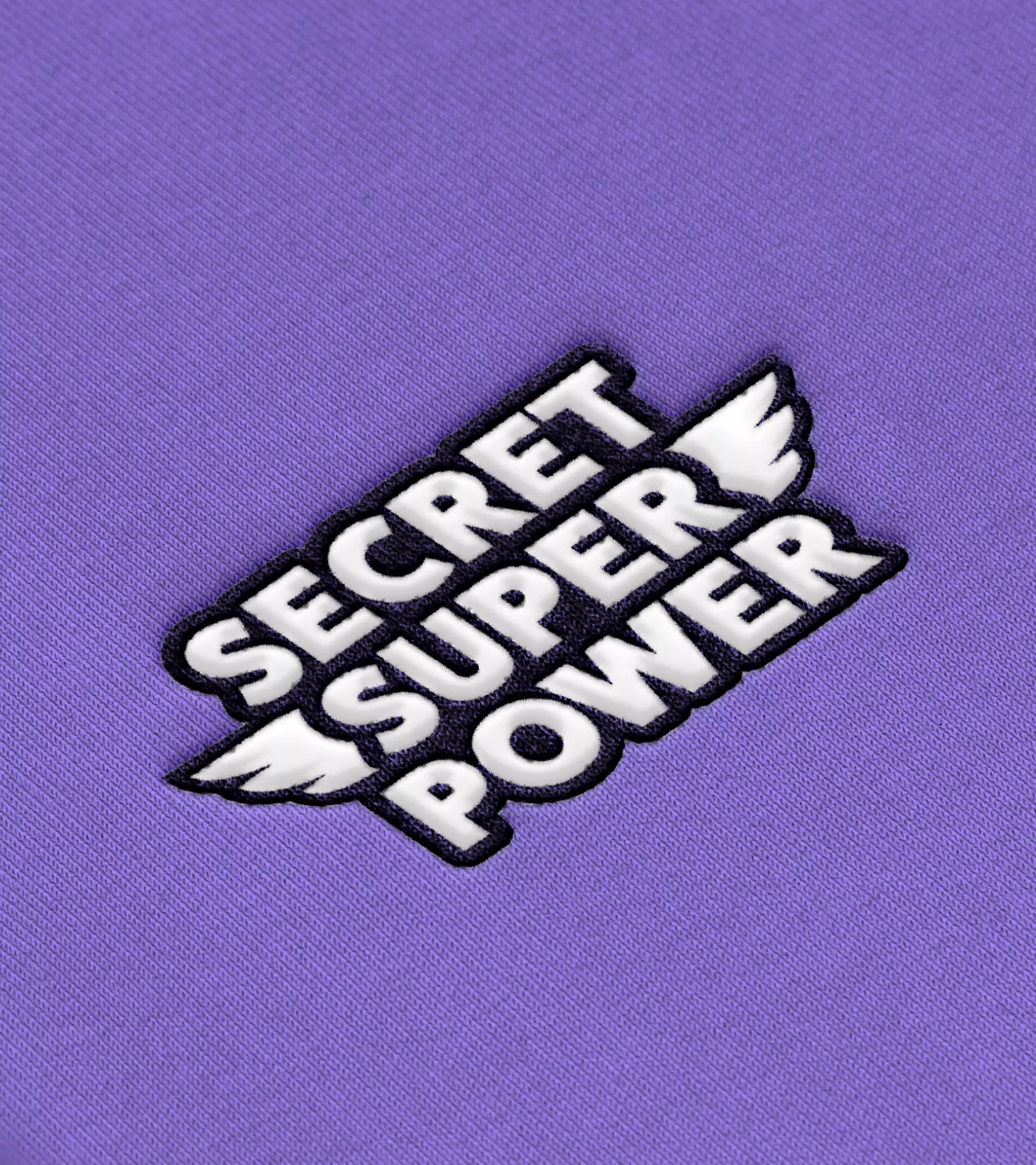 An example of the implementation where you see the logo printed on a purple sweater