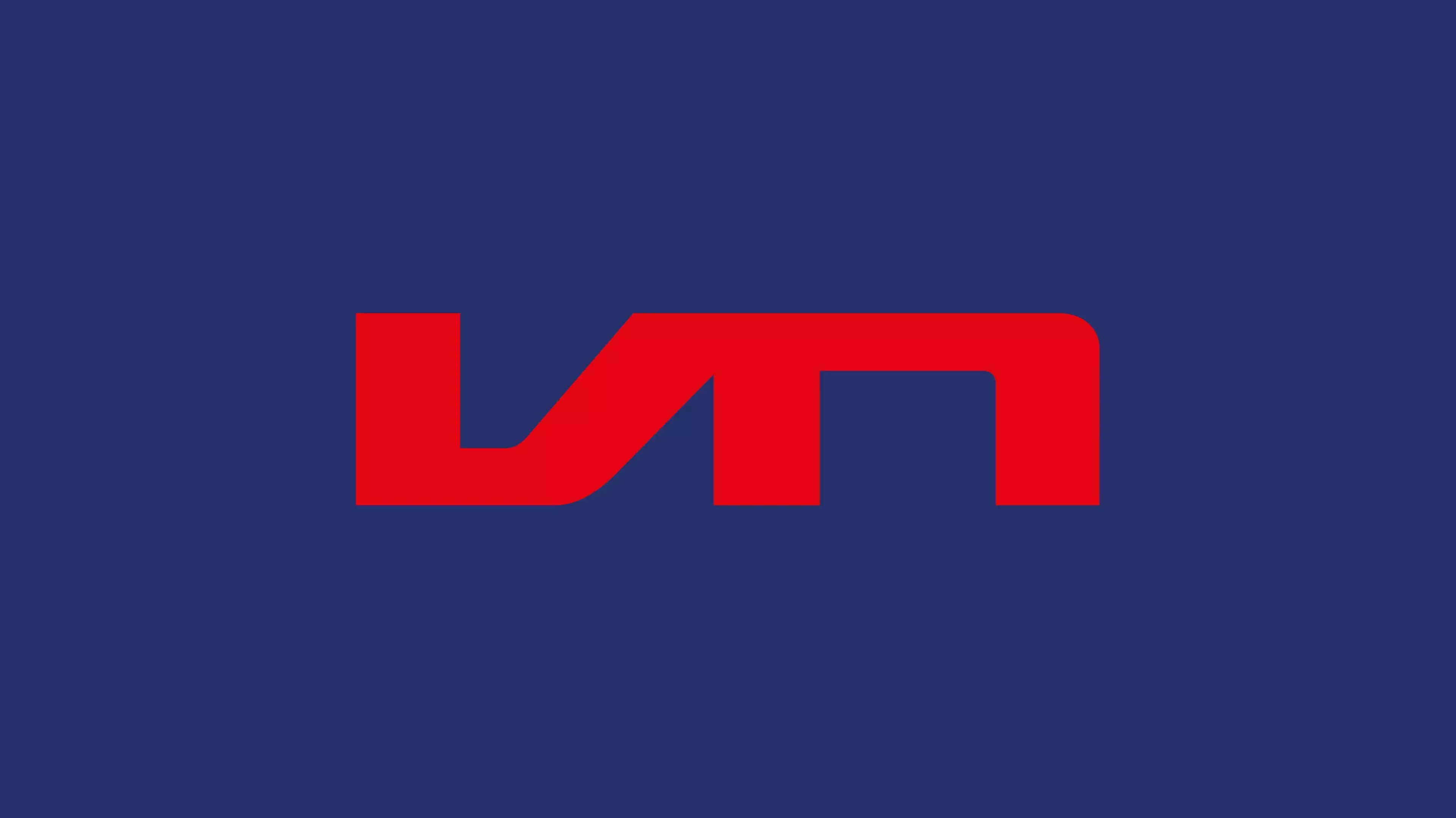 The logo of Vrij Nederland in a red color on a dark blue background