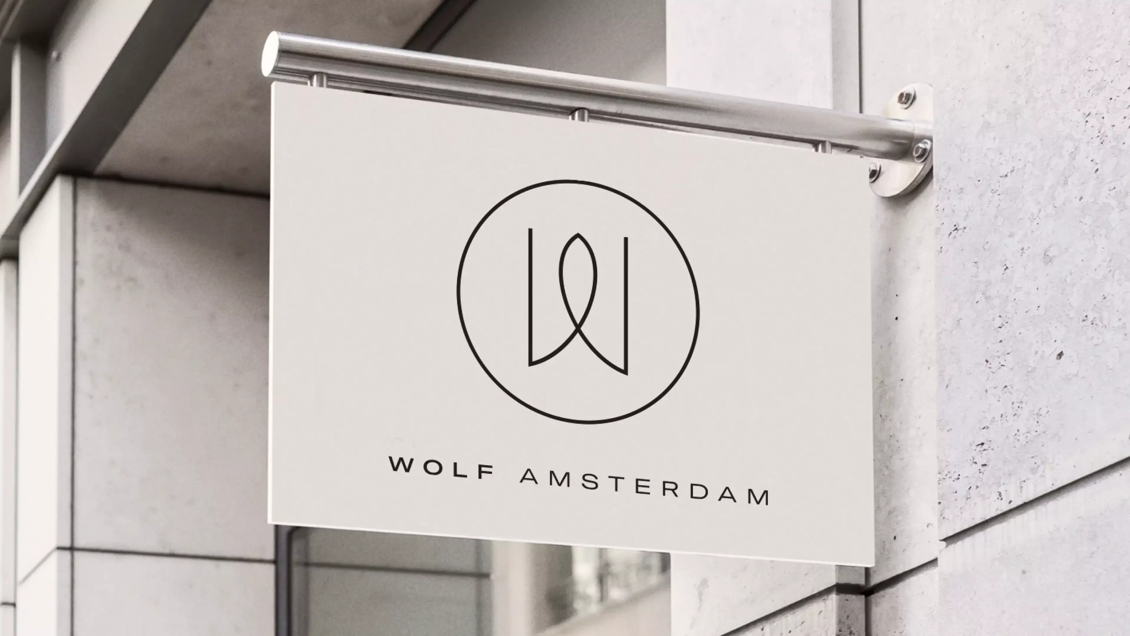 A signboard displaying the logo of Wolf Amsterdam