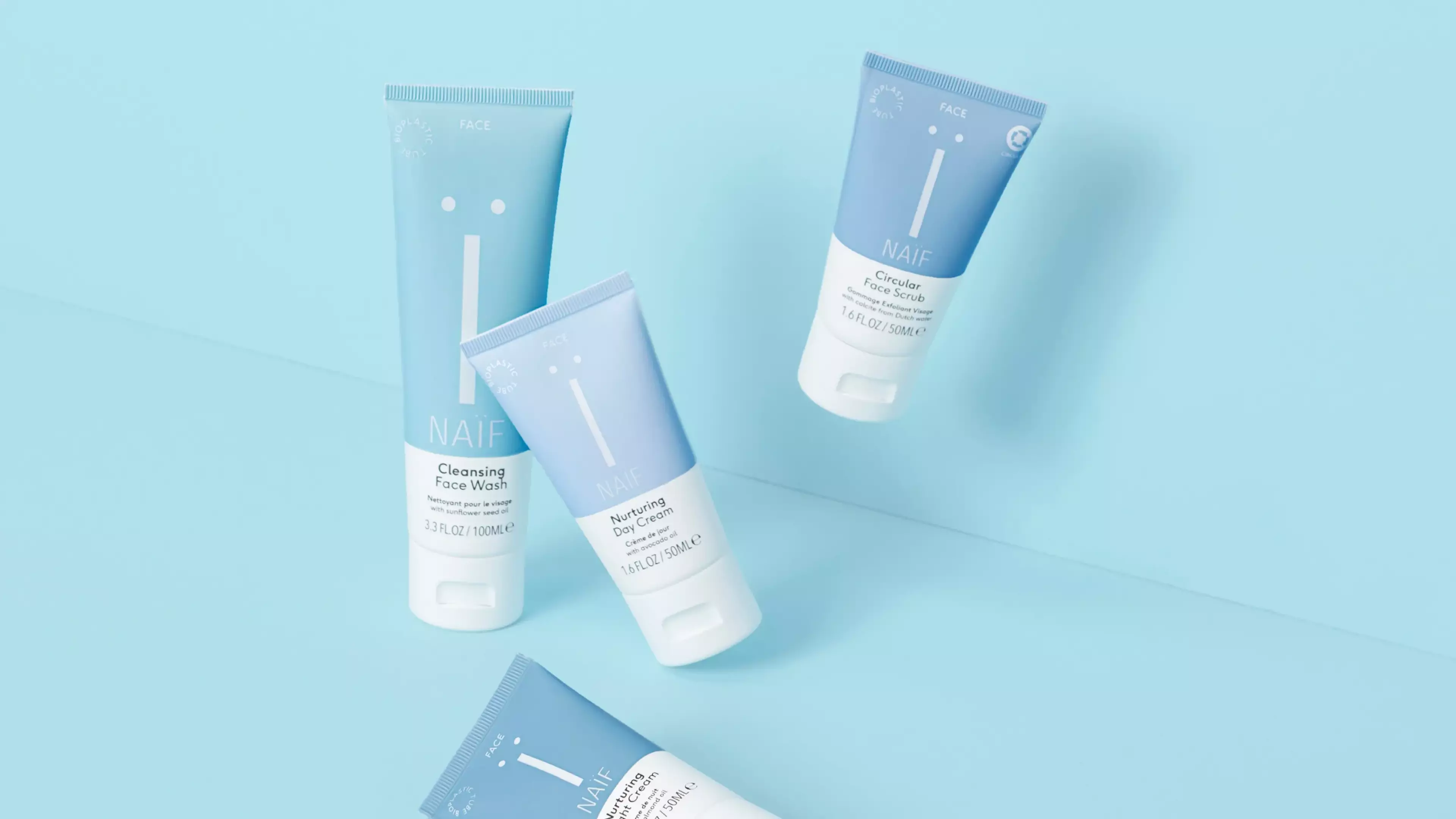 An image of several facial packaging products such as scrub, day cream and wash gel