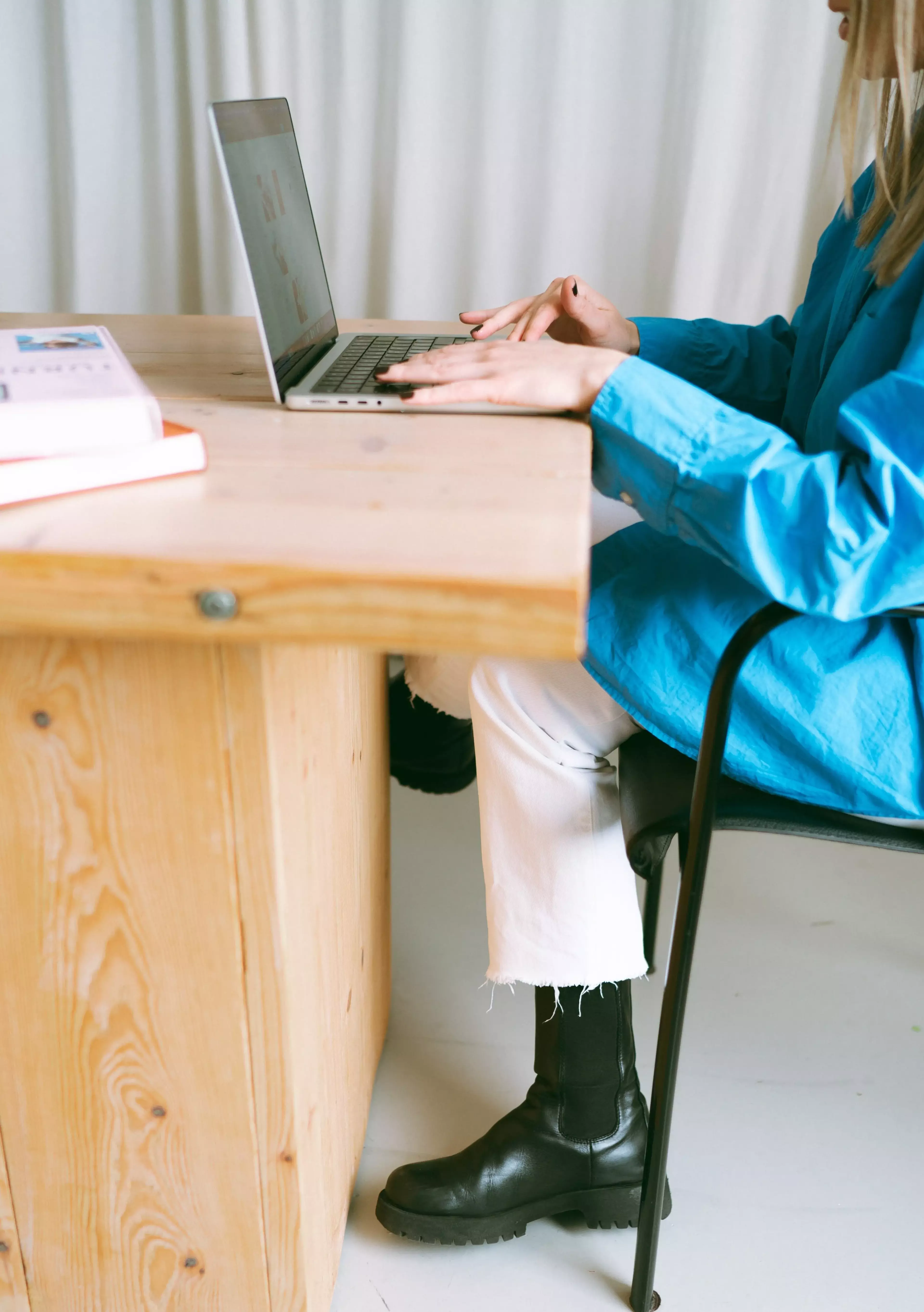 Sitting behind a laptop